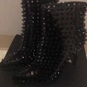 Patent spiked boots